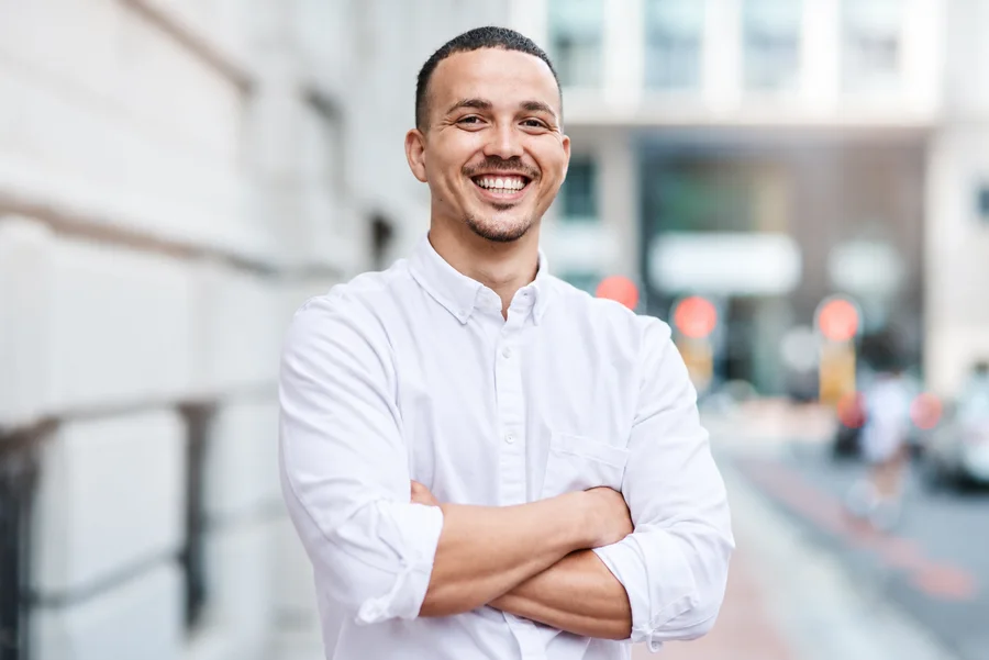 Smiling professional in a white shirt